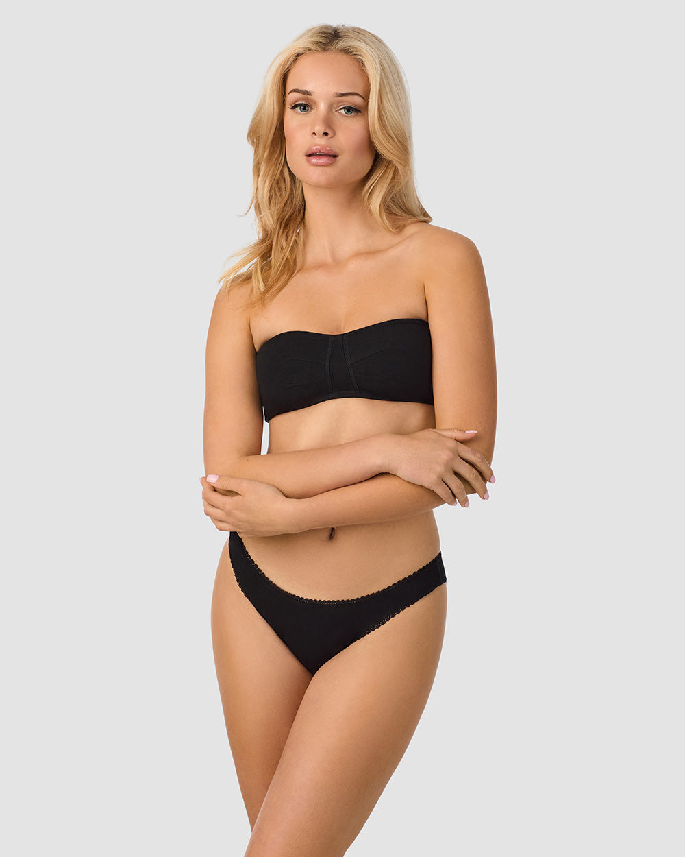 A lady wearing Black Cabana Cotton Bandeau Bralette