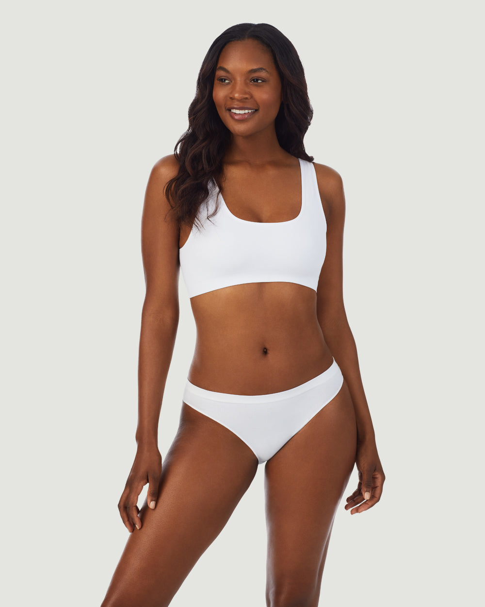 A lady wearing White Cabana Cotton Seamless Easy Tank Bralette