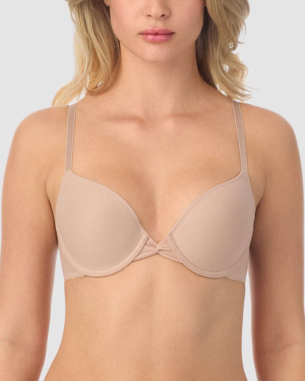 A lady wearing champagne gossamer mesh bump-it-up bra.
