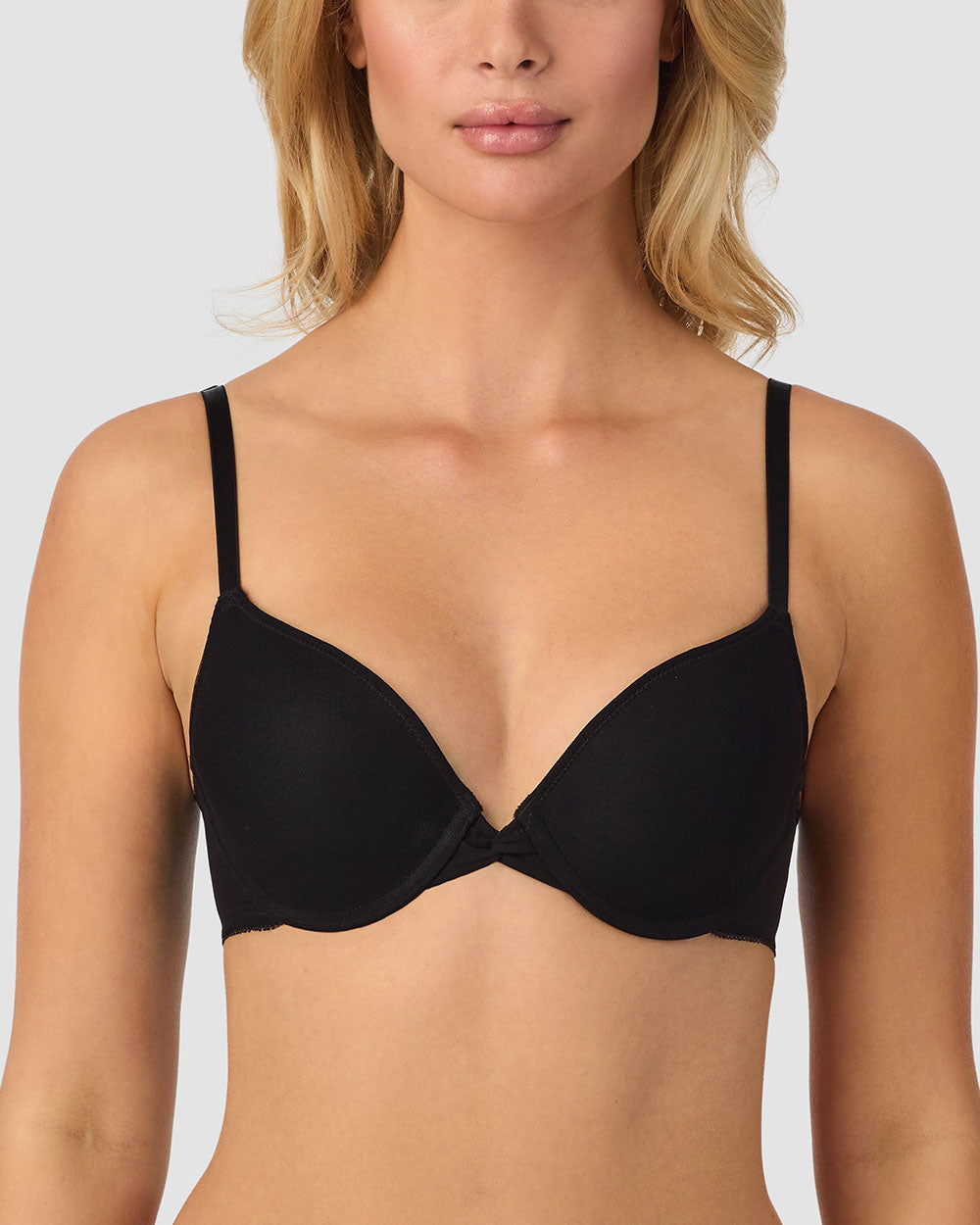 A lady wearing a black gossamer mesh bump-it-up-bra.