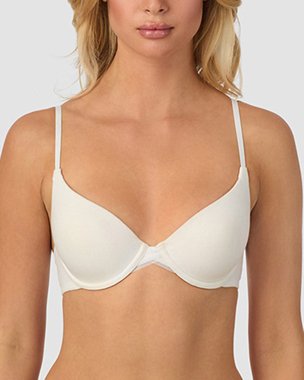 A lady wearing white Cabana Cotton Convertible T-Shirt Bra