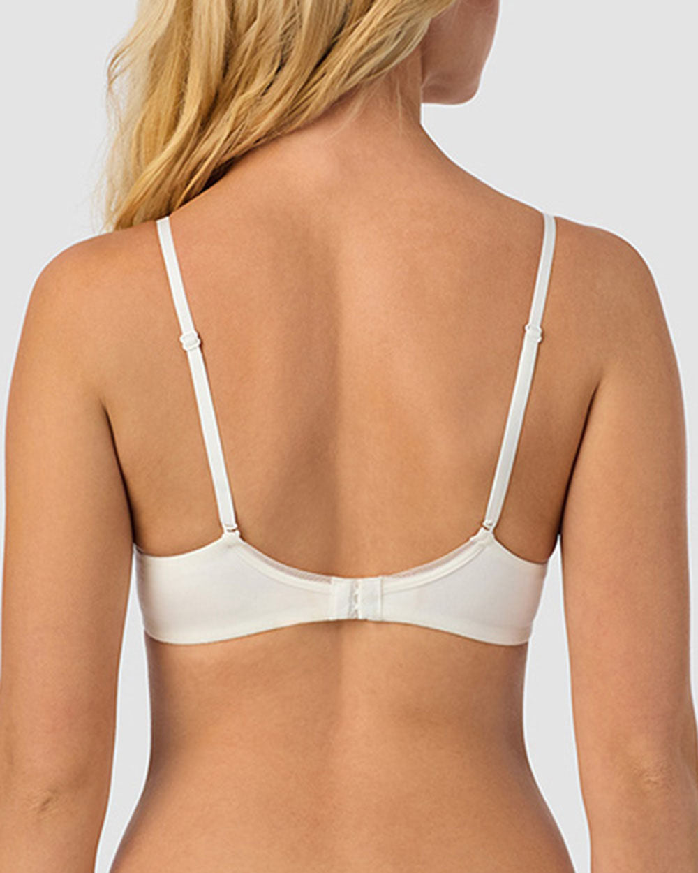 A lady wearing white Cabana Cotton Convertible T-Shirt Bra