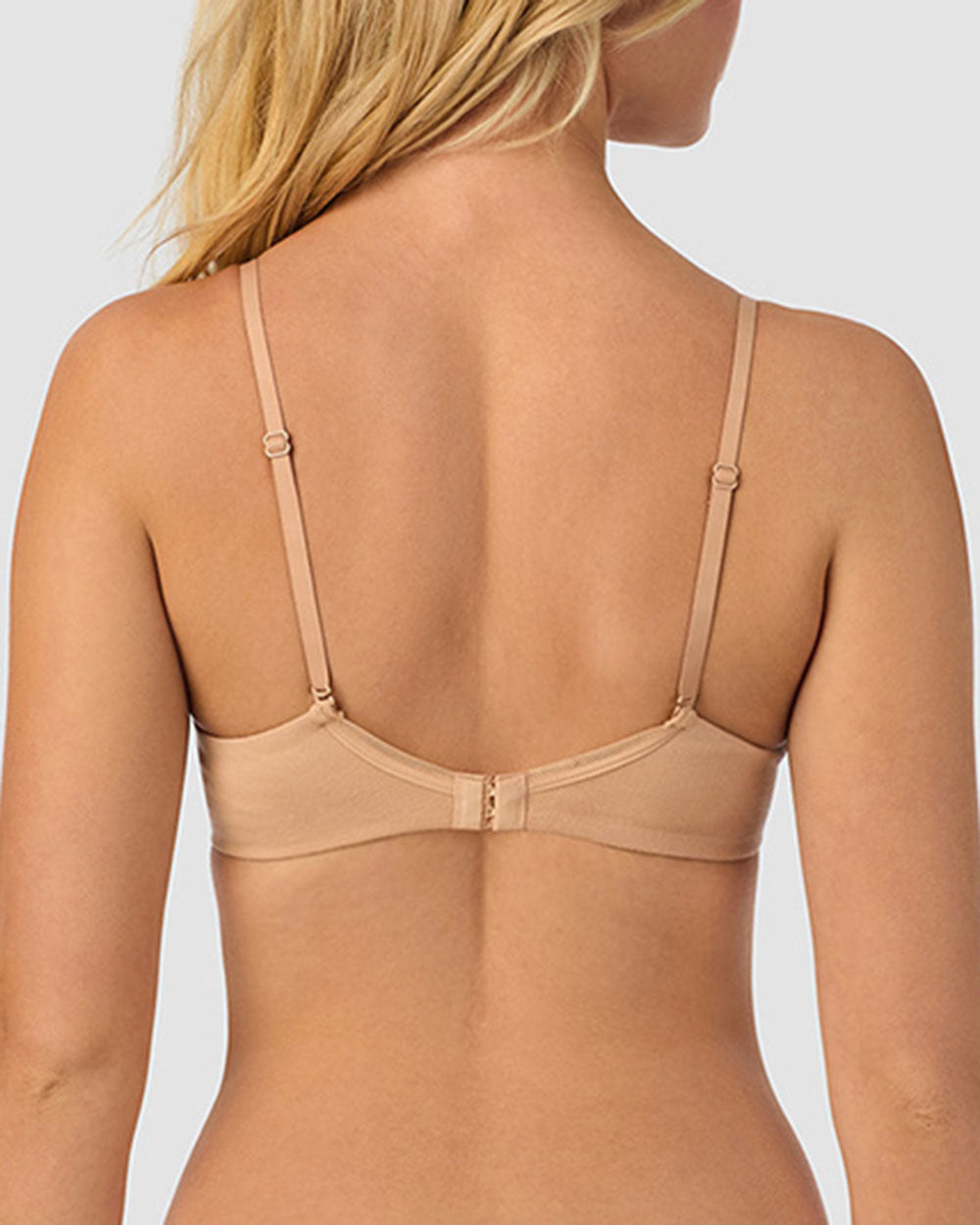 A lady wearing champagne cabana cotton convertible t-shirt bra.