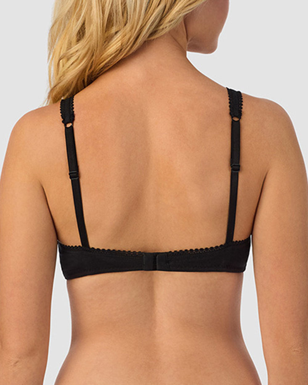 A lady wearing black Cabana Cotton Bralette