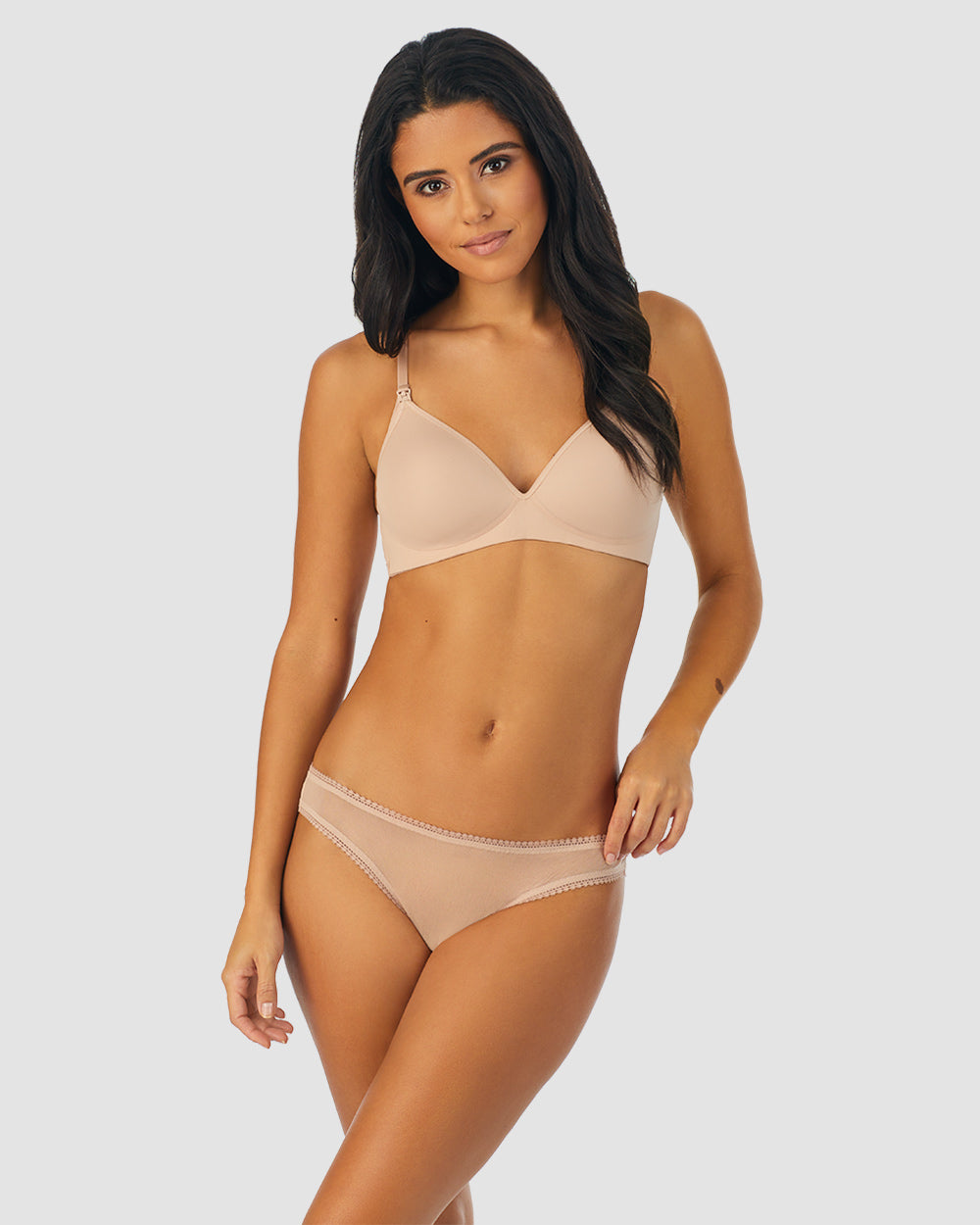 A lady wearing champagne next to nothing micro wireless nursing bra.