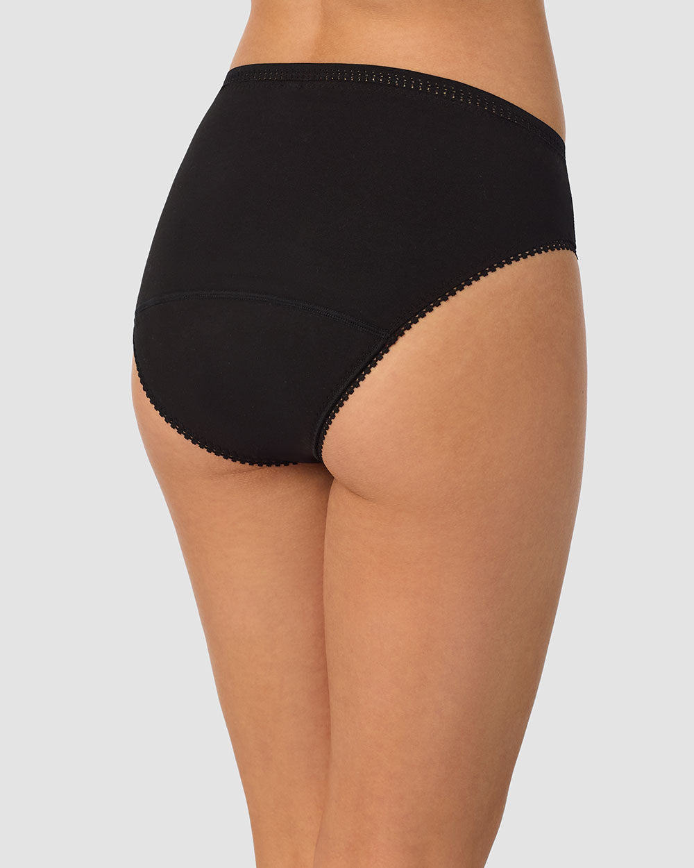 A lady wearing black Cabana Cotton Leak Proof Hi Cut Brief