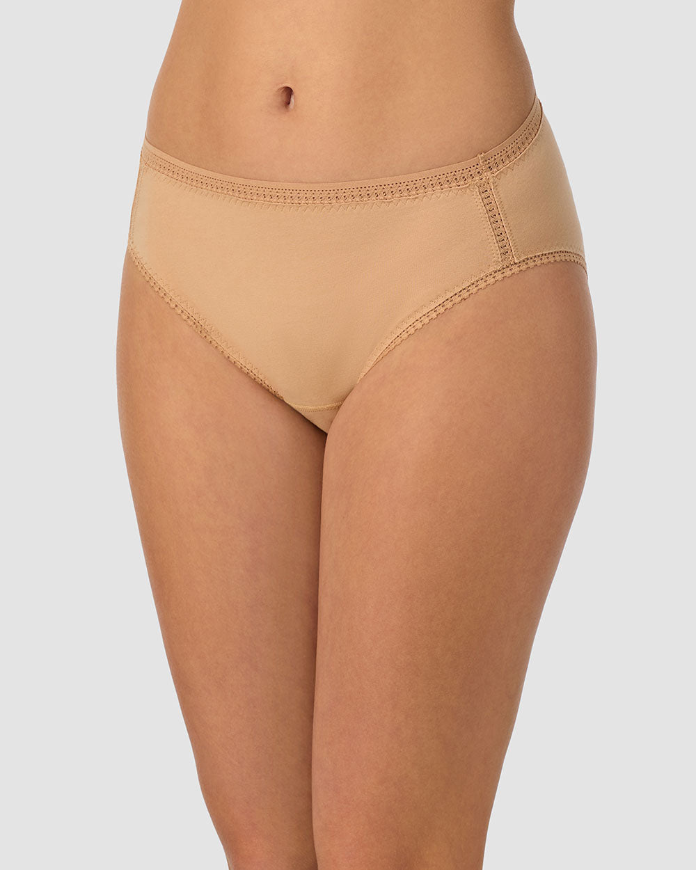 A lady wearing champagne Cabana Cotton Leak Proof Hi Cut Brief