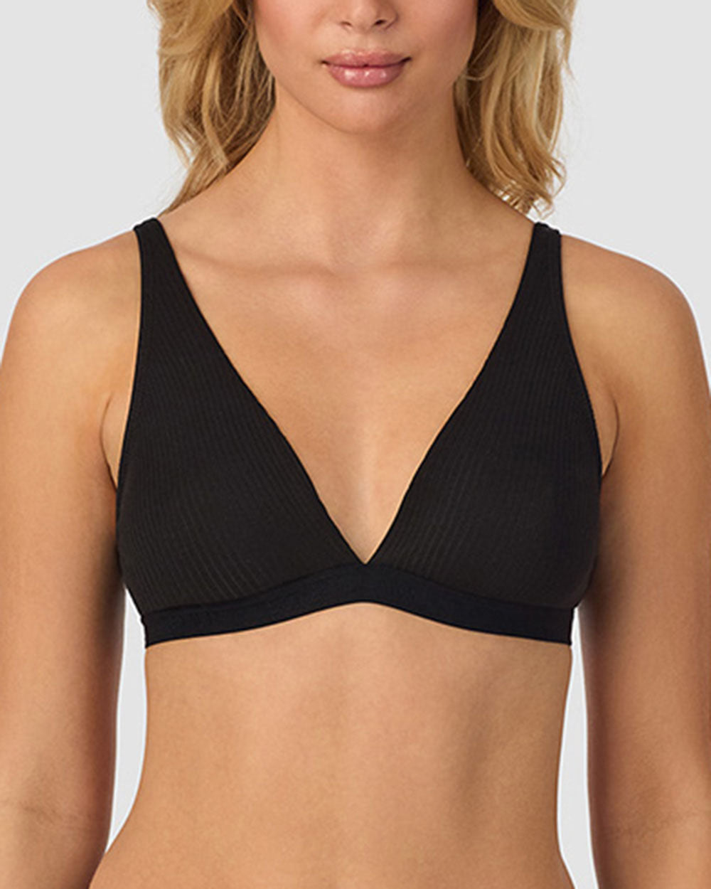 A lady wearing black Cabana Cotton Rib Plunge Bralette