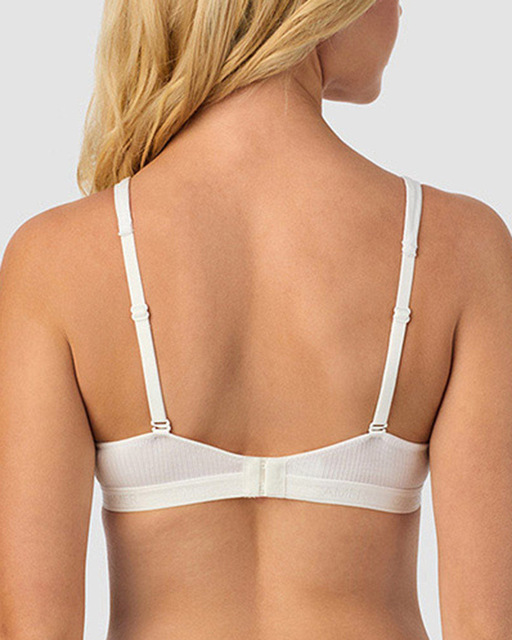 A lady wearing white Cabana Cotton Rib Plunge Bralette