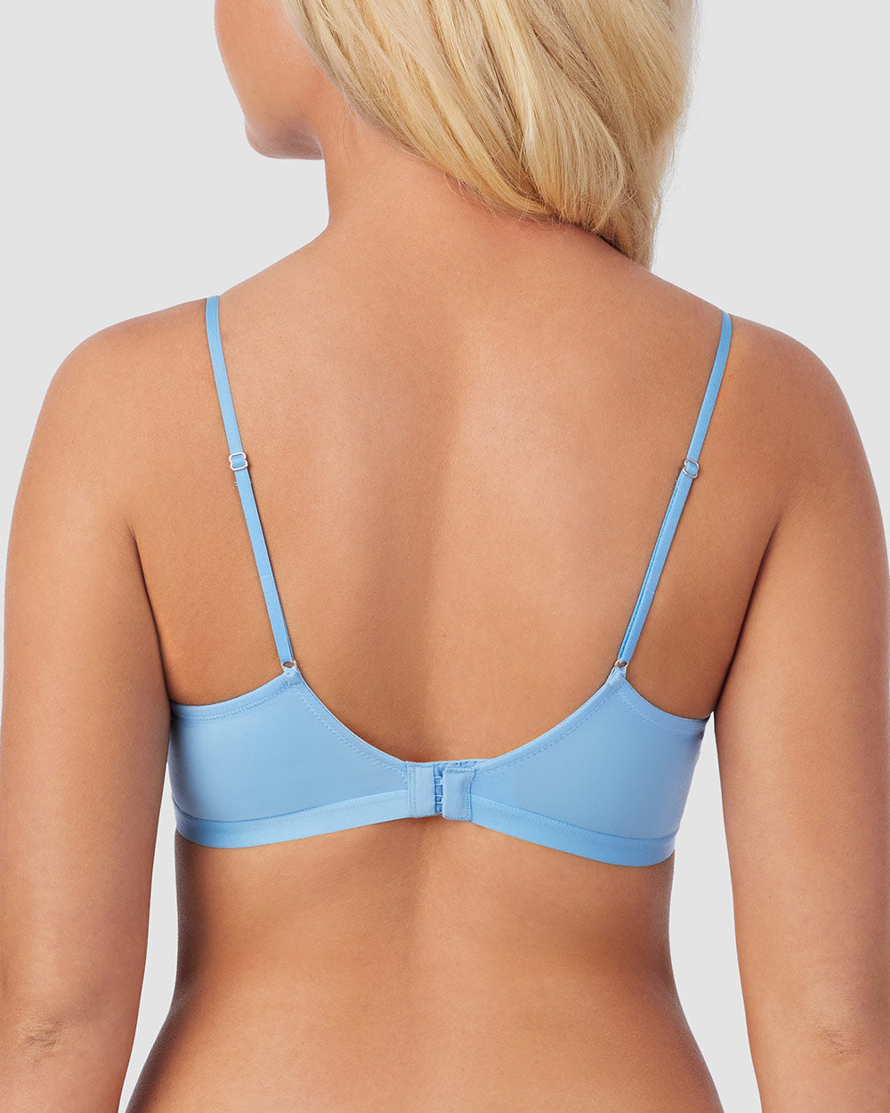 A lady is wearing Blue Hydrangea Next to Nothing Micro Wireless Bra