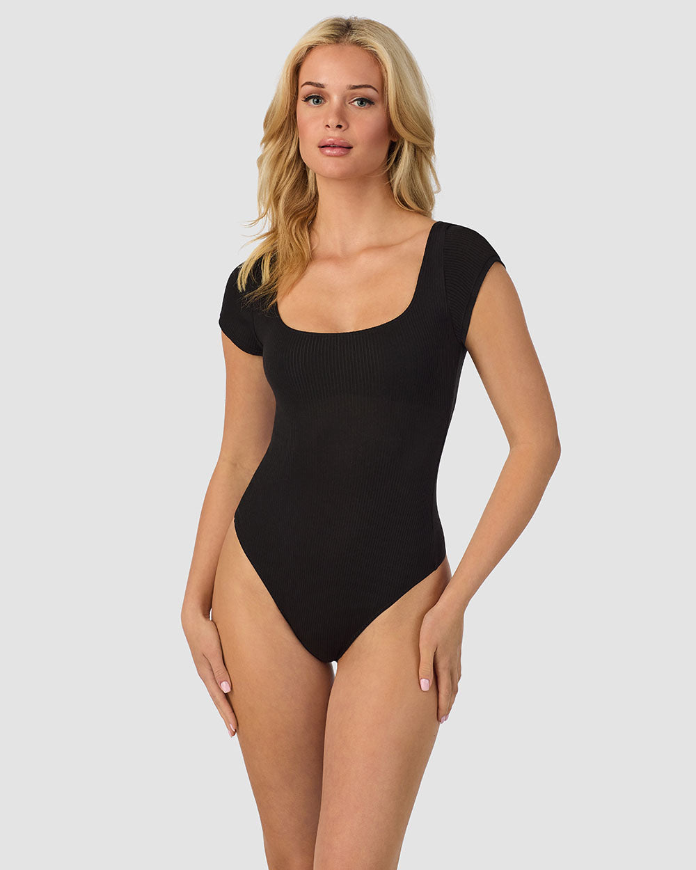 A lady wearing black Cabana Cotton Rib Bodysuit