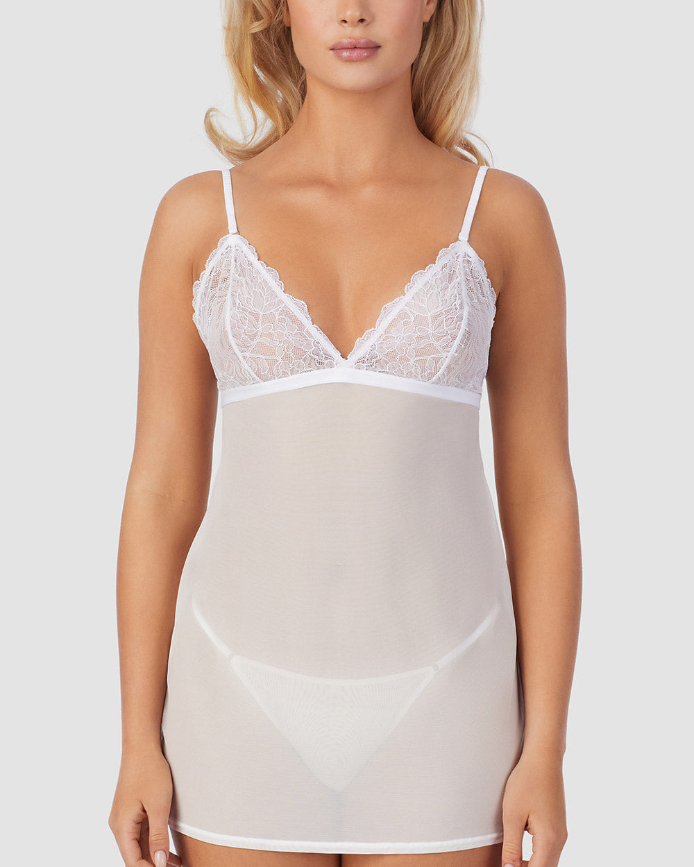A lady wearing Luxe Lace Chemise String Thong Set in White