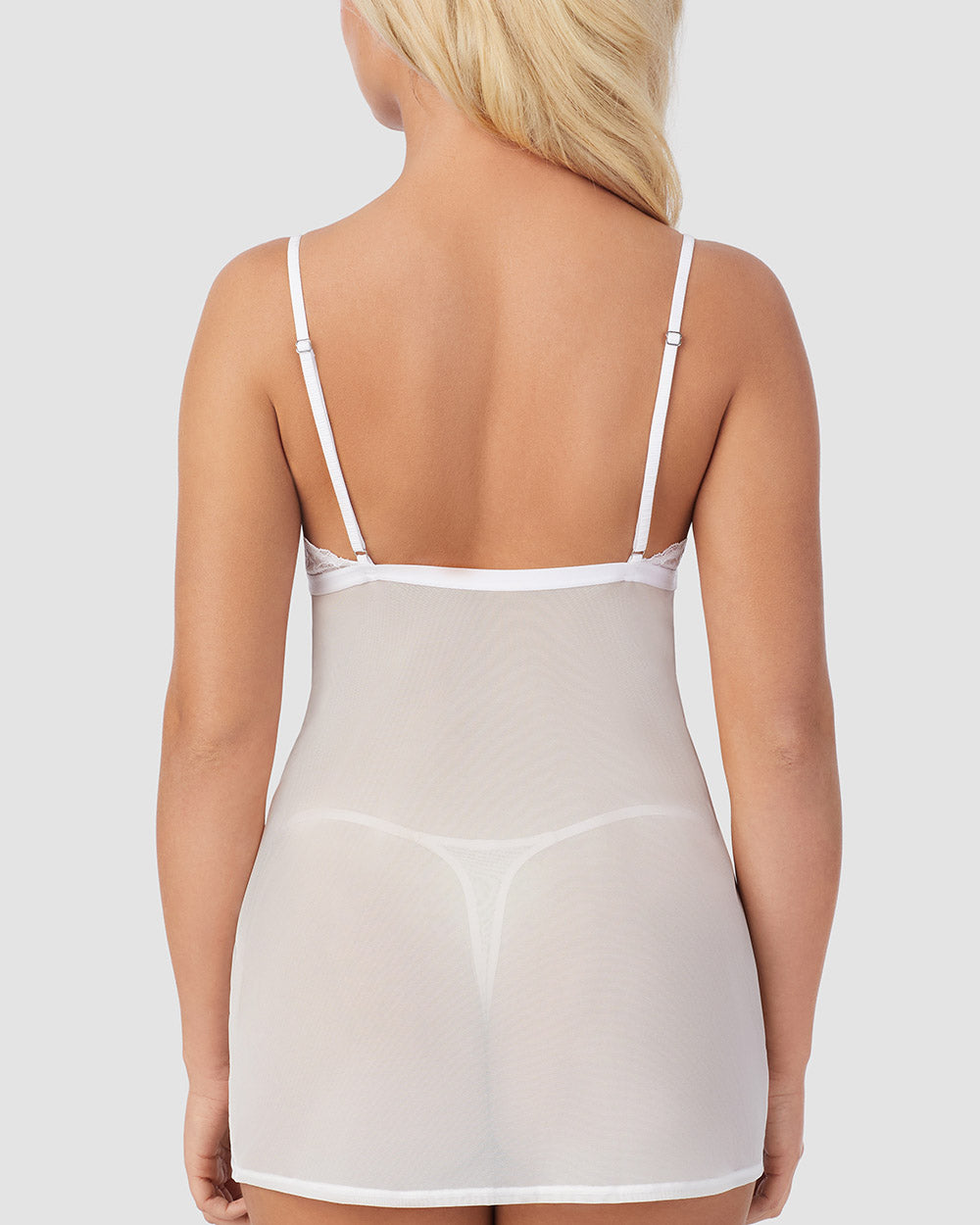 A lady wearing Luxe Lace Chemise String Thong Set in White