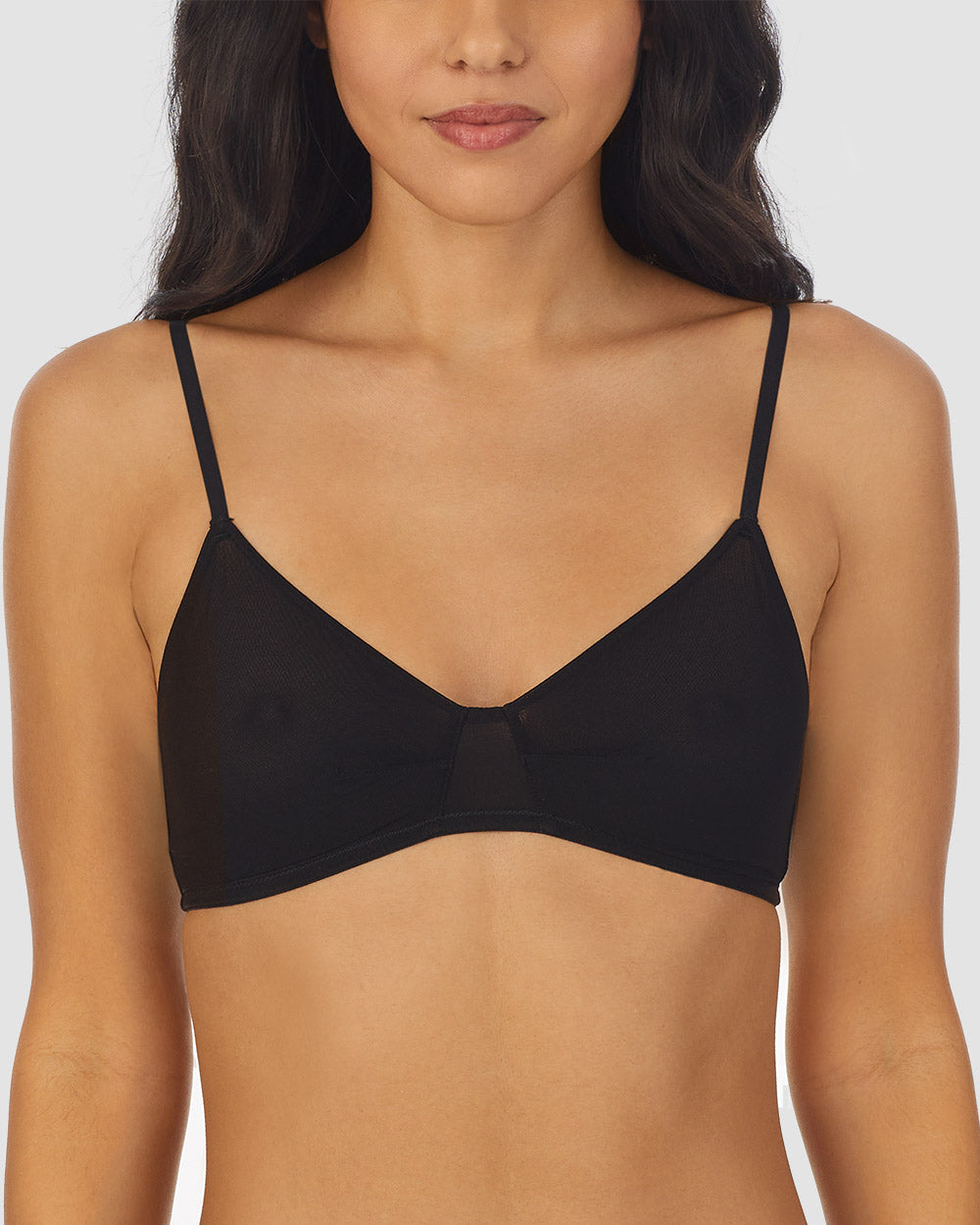 A lady wearing black Next to Nothing Bralette