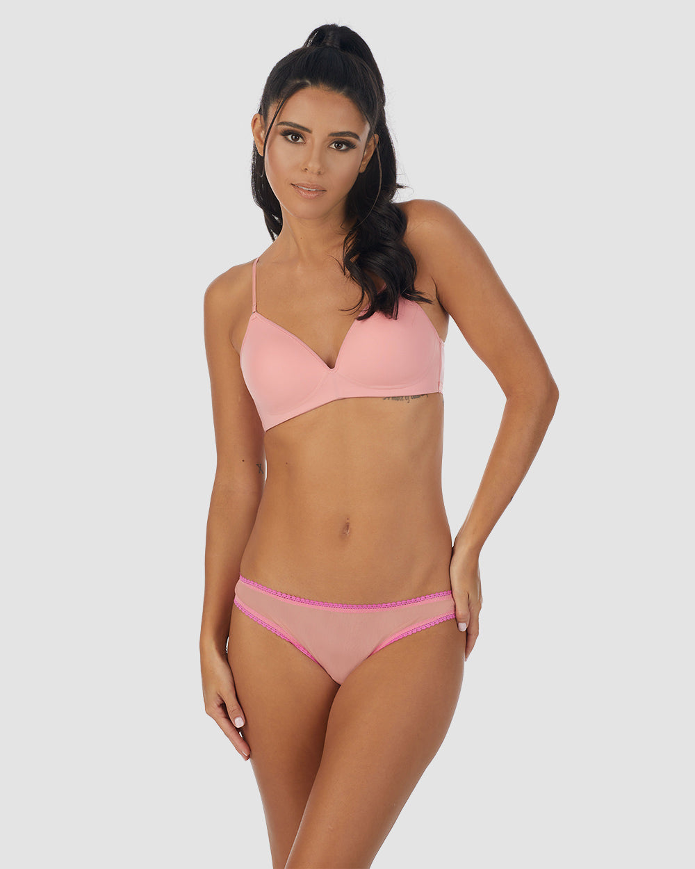 A lady wearing pink Next To Nothing Micro Wireless Bra