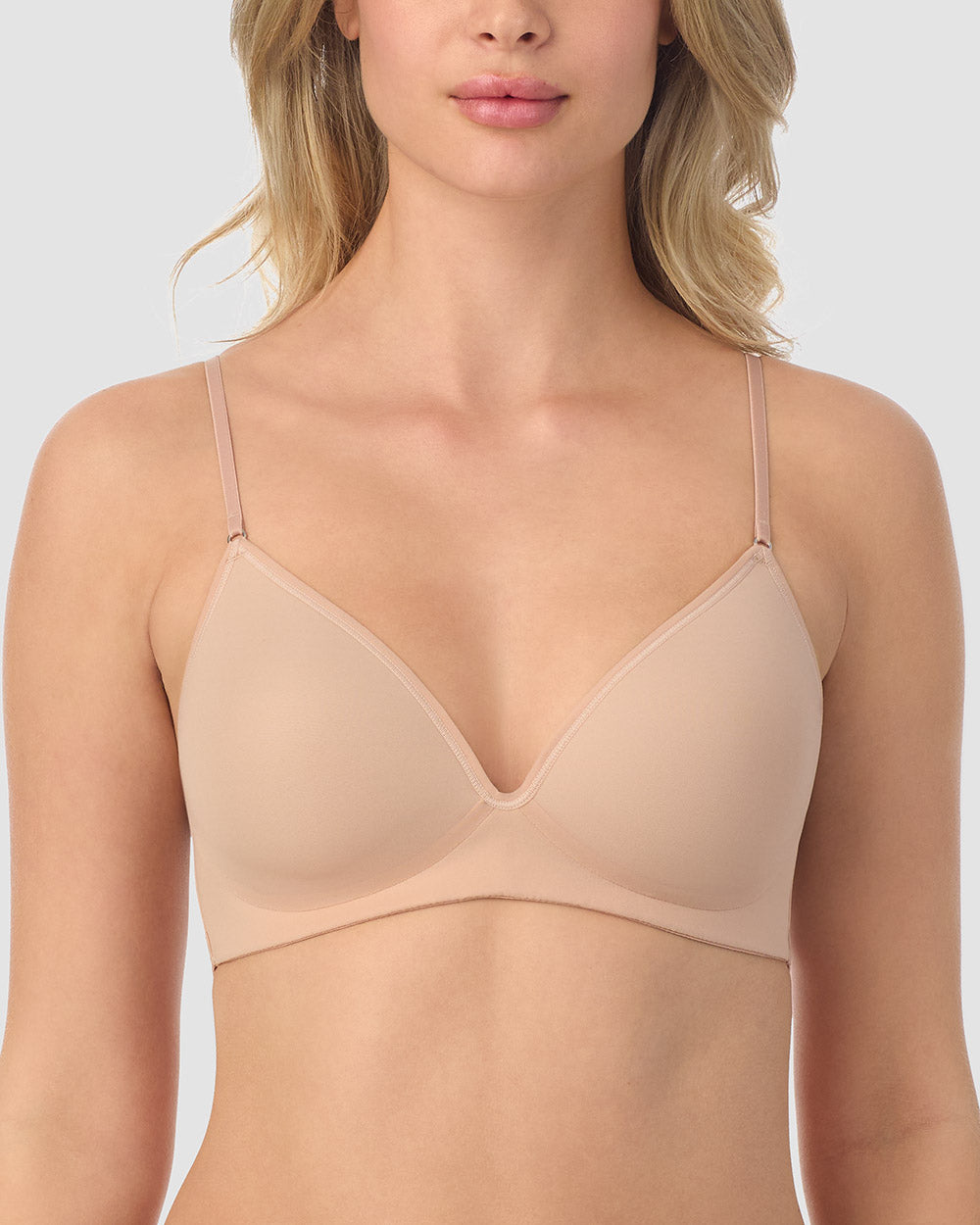 A lady wearing champagne next to nothing micro wireless bra.