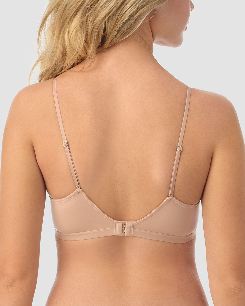 A lady wearing champagne next to nothing micro wireless bra.