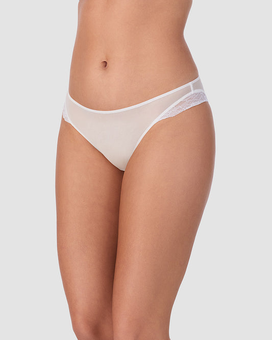 A lady wearing Luxe Lace Bikini in White