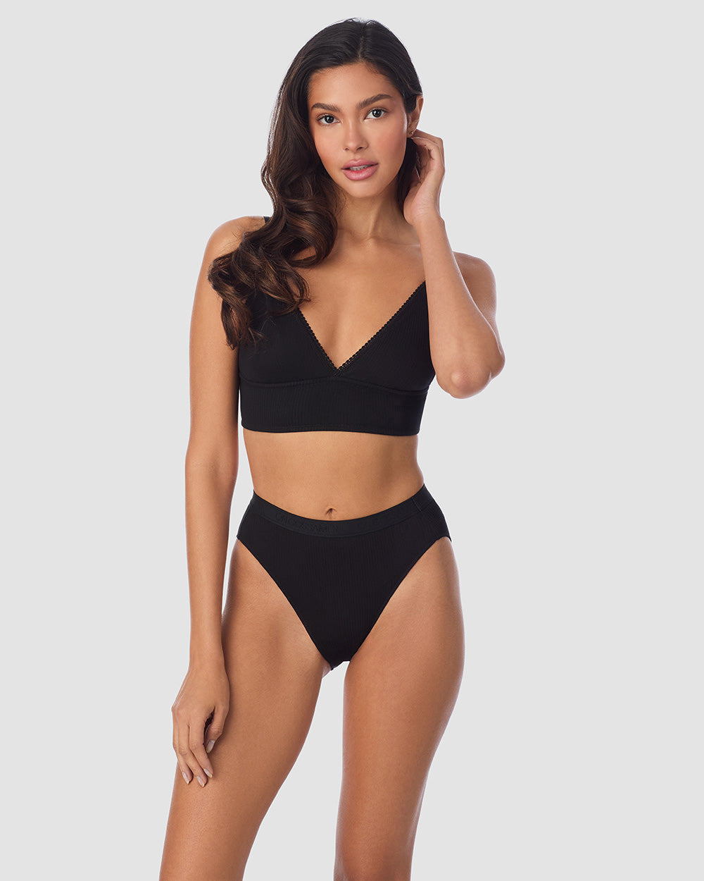 A Lady Wearing Cabana Cotton Rib Longline Triangle Bralette - Black posing with a front view look