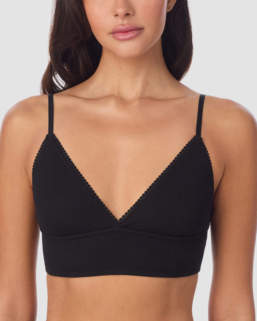 A Lady Wearing Cabana Cotton Rib Longline Triangle Bralette - Black facing front with a slight close up shot