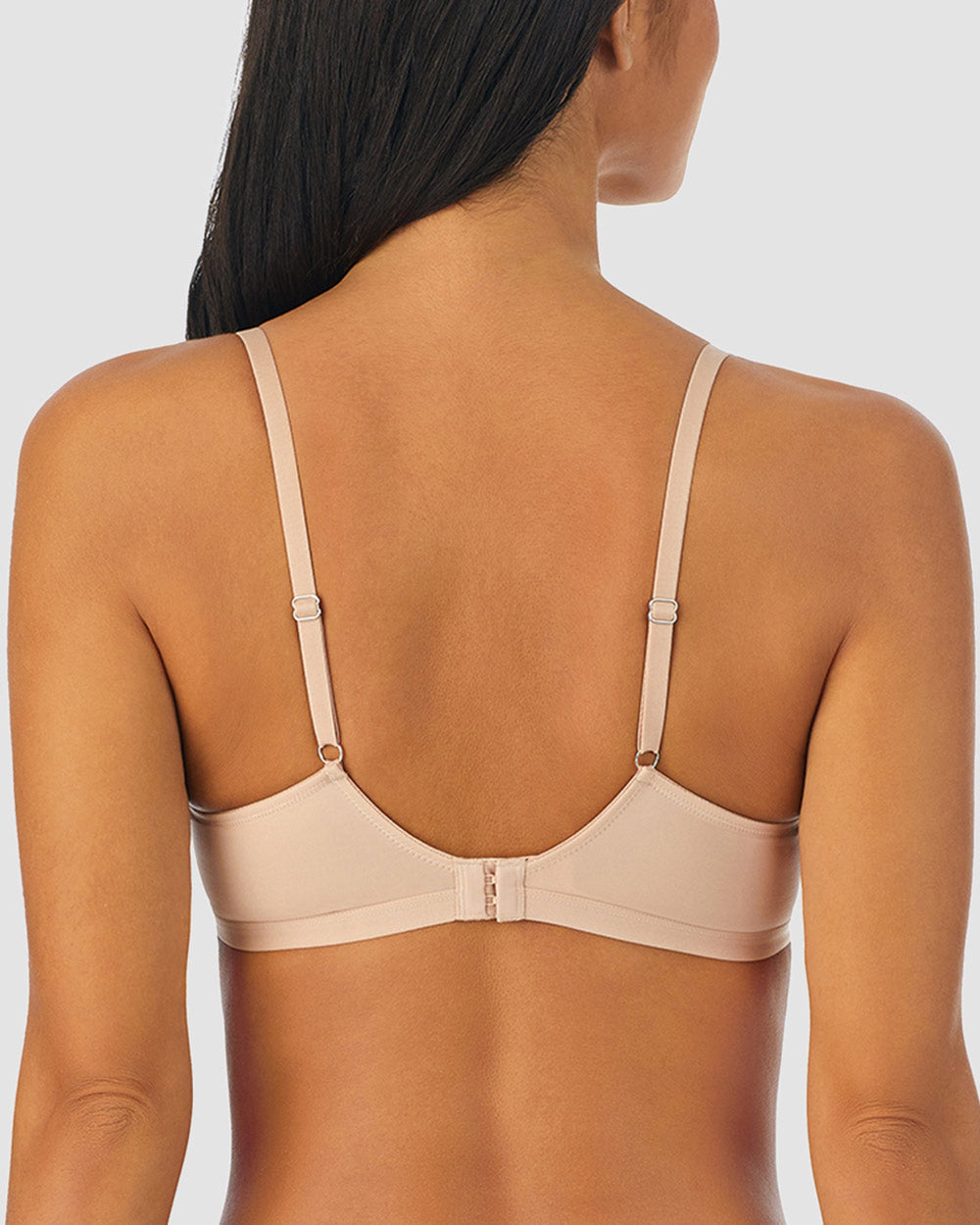 A lady wearing champagne next to nothing micro wireless nursing bra.