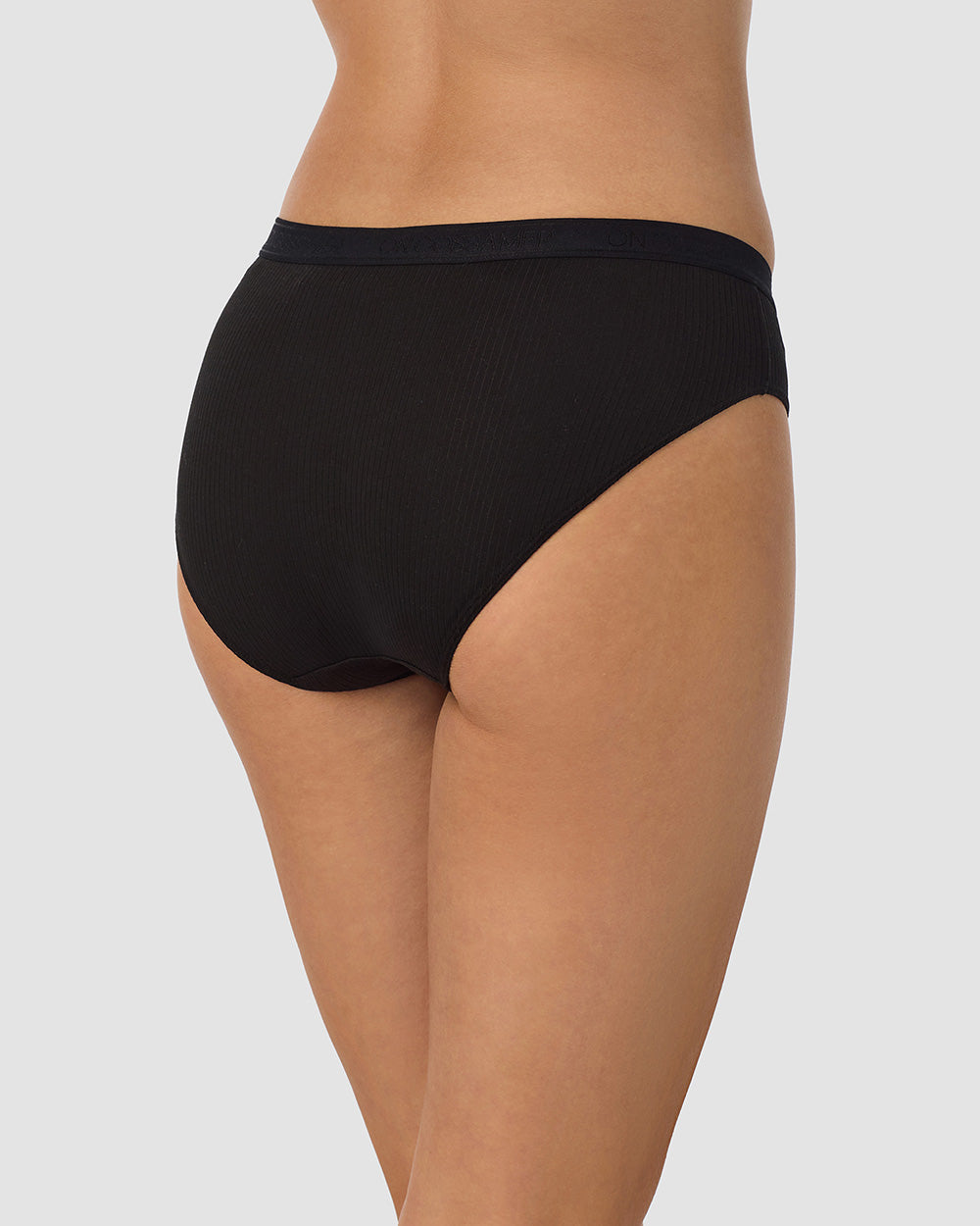 A lady wearing  Black Cabana Cotton Rib Bikini