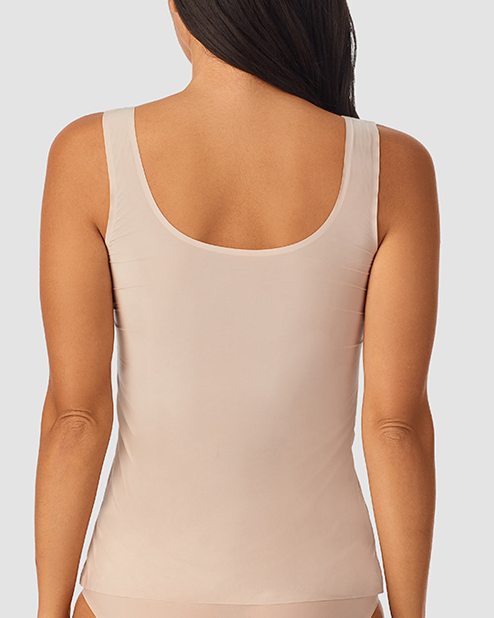 A lady wearing Champagne Heavenly Stretch Tank