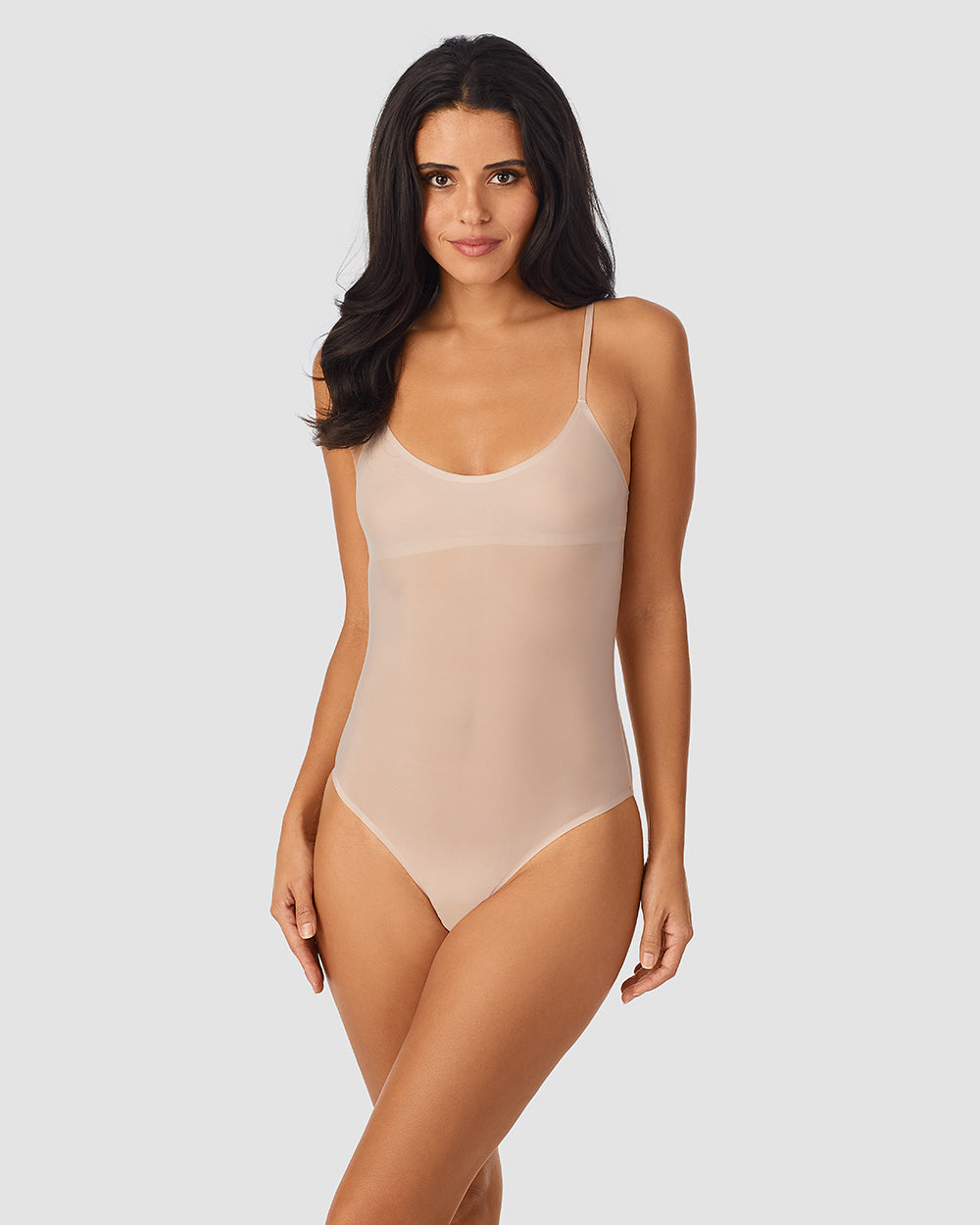 A lady wearing Heavenly Stretch Bodysuit Champagne