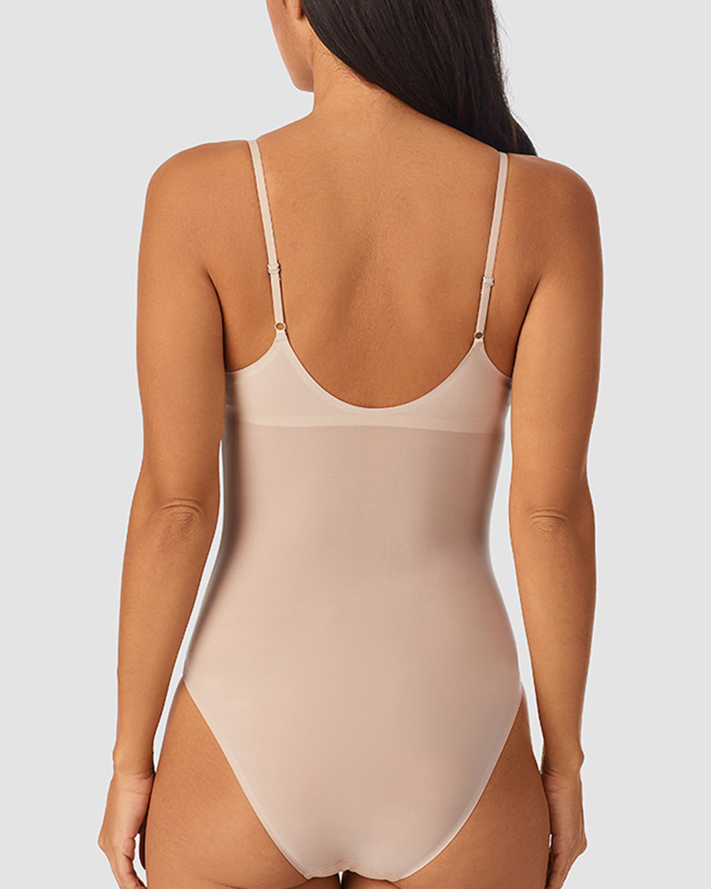 A lady wearing Heavenly Stretch Bodysuit Champagne