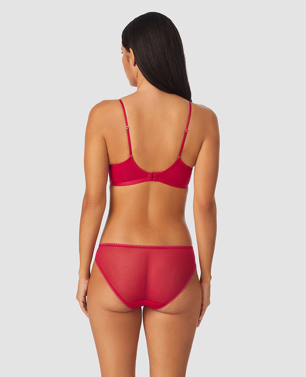 A lady wearing red hot next to nothing micro wireless bra