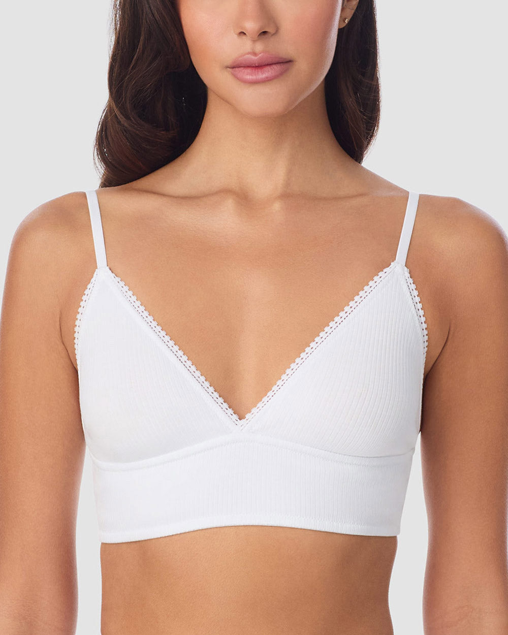 A Lady Wearing Cabana Cotton Rib Longline Triangle Bralette - White posing front view with a close up look