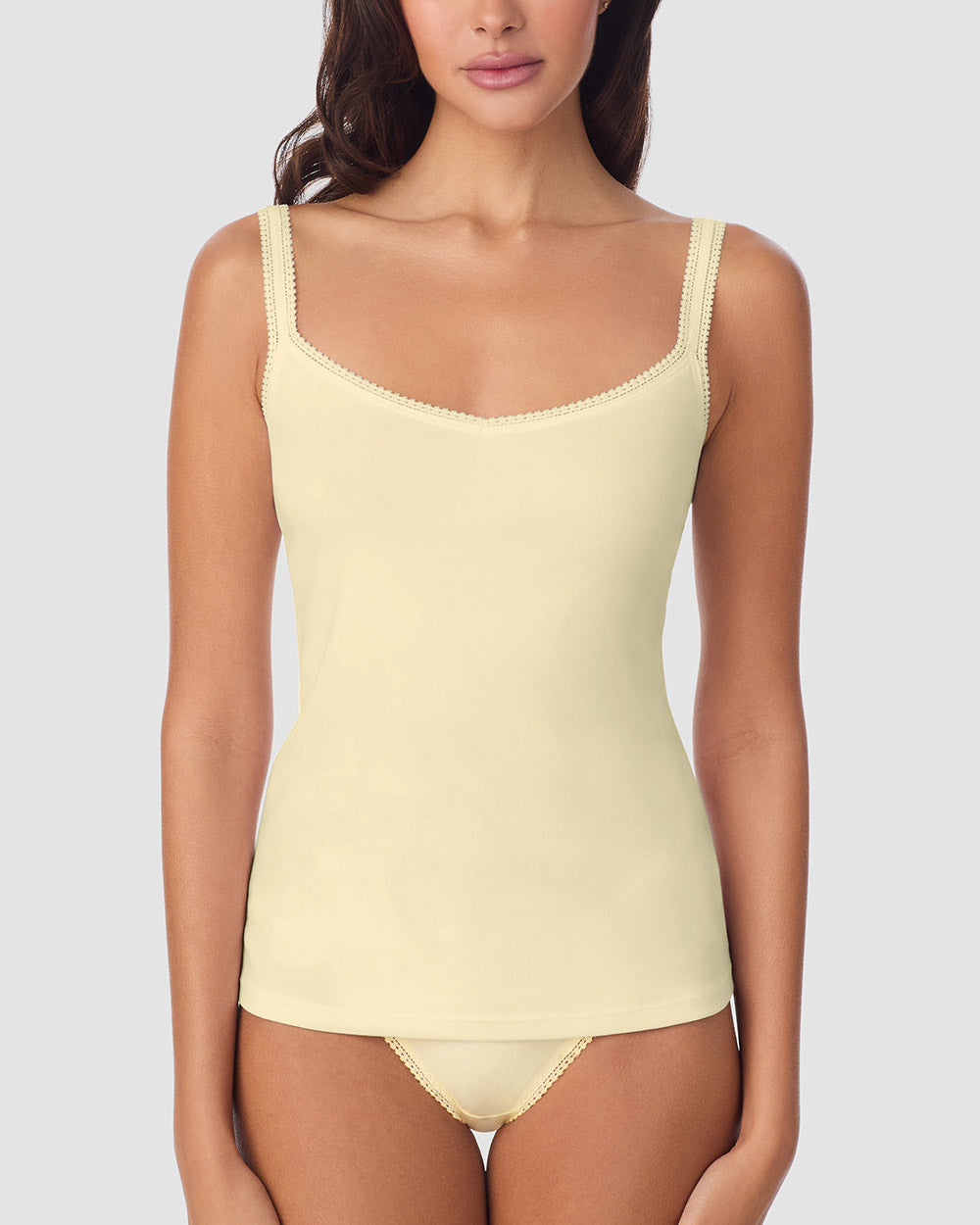 A Lady Wearing Cabana Cotton Reversible Cami - Banana Cream facing front with a straight look