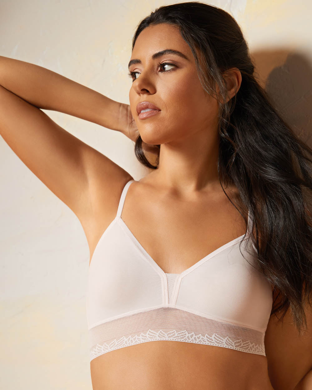 A lady wearing mauve chalk next to nothing micro triangle bralette.