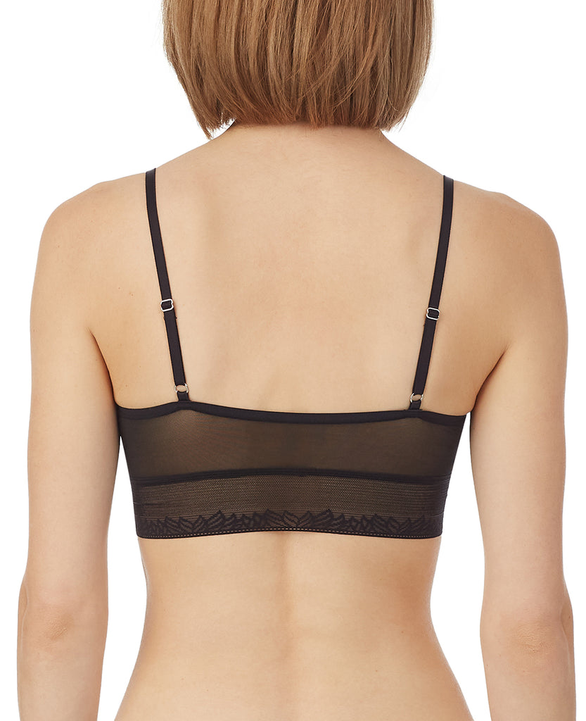 A lady wearing black next to nothing micro triangle bralette.