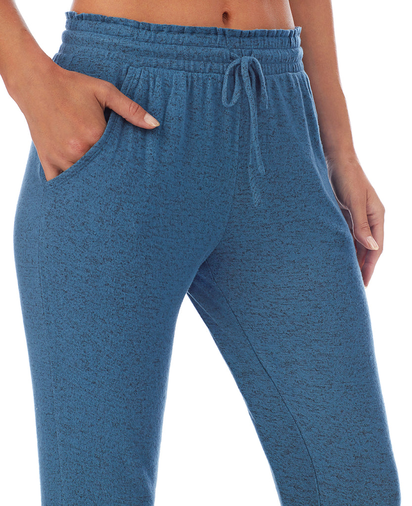 A lady wearing Purist Teal Jogger